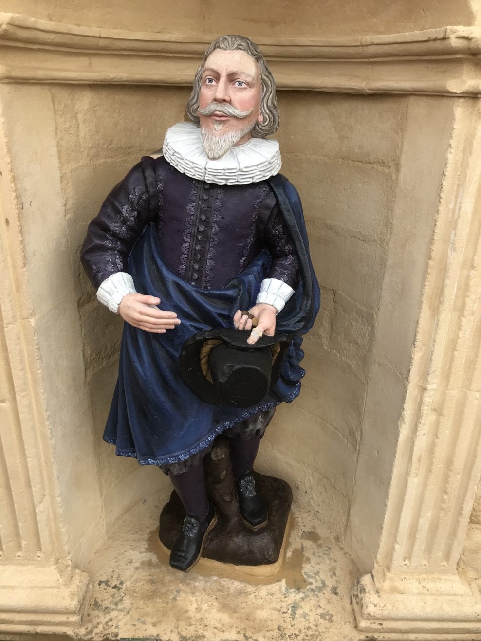 Installed polychrome sandstone statue of John Cowane in the same position as before dismantled.