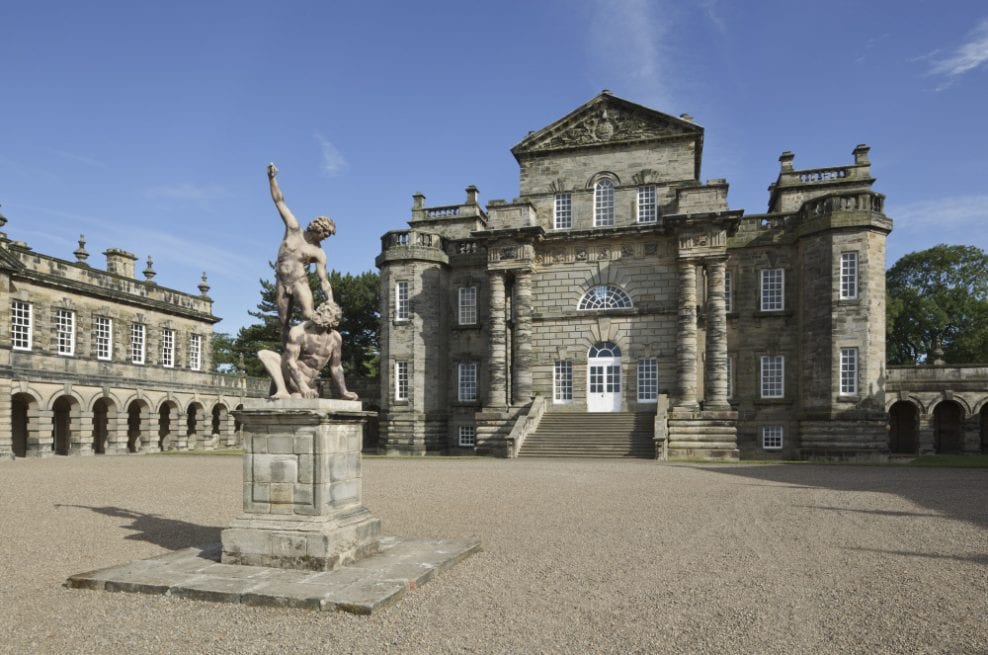 Exterior view of Seaton Delaval Hall, Northumberland with sculpture in the foreground