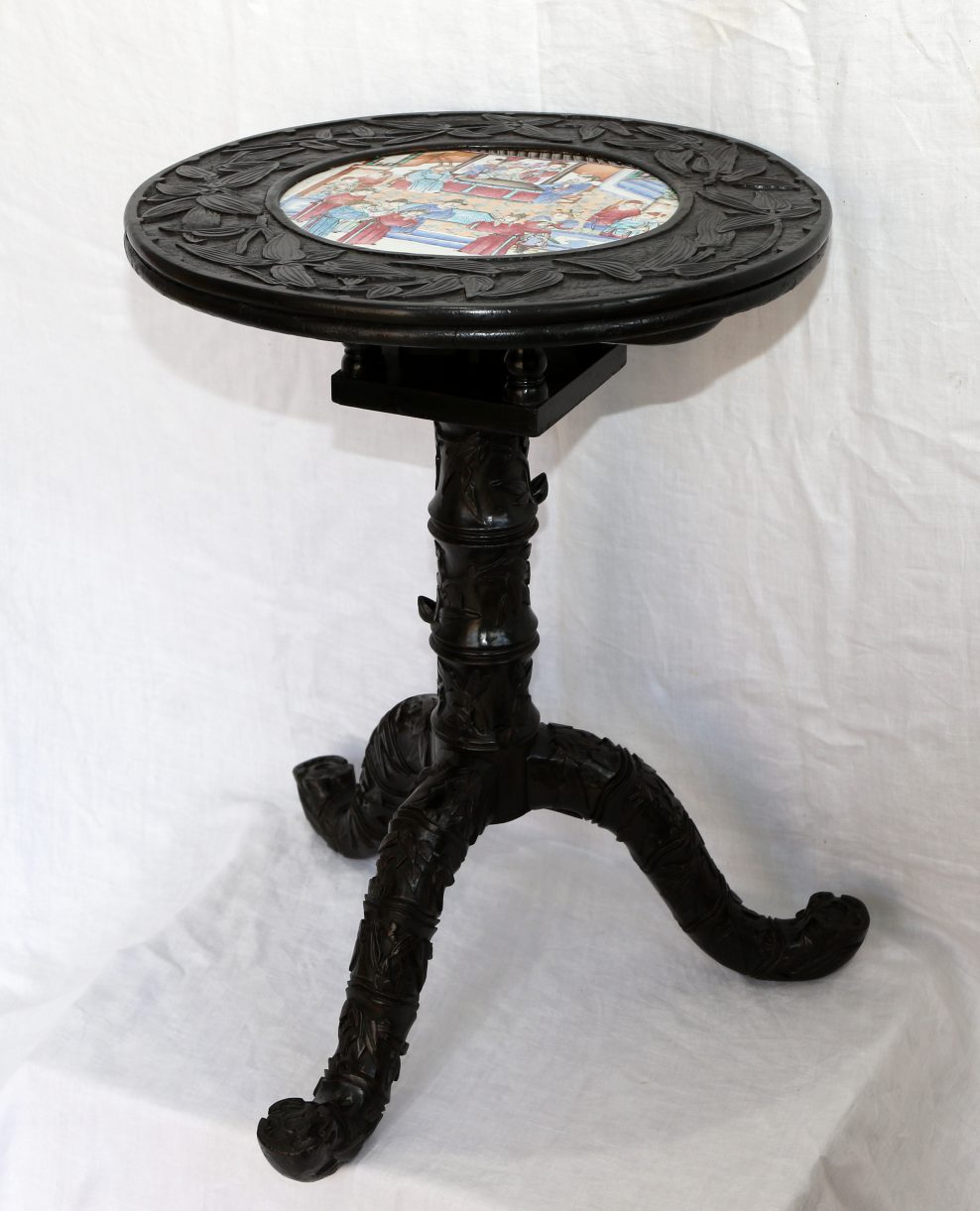 Chinese ebonised and lacquered tripod table with porcelain plaque