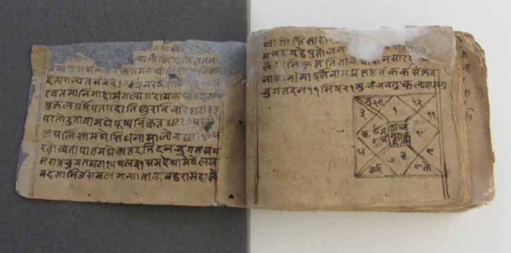 Hindi manuscript with mould, insect damage and adhered pages.