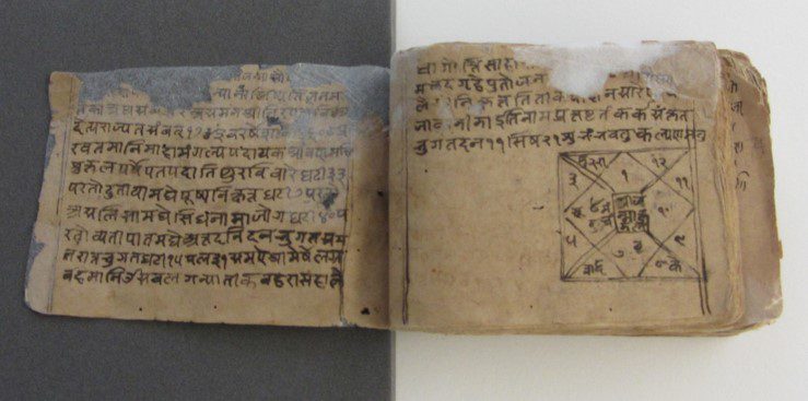 Historical manuscript with mould, insect damage and adhered pages.