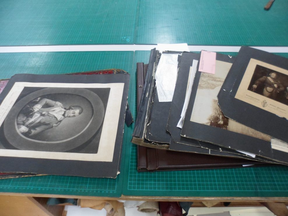 Restoration and re-binding of two photograph albums
